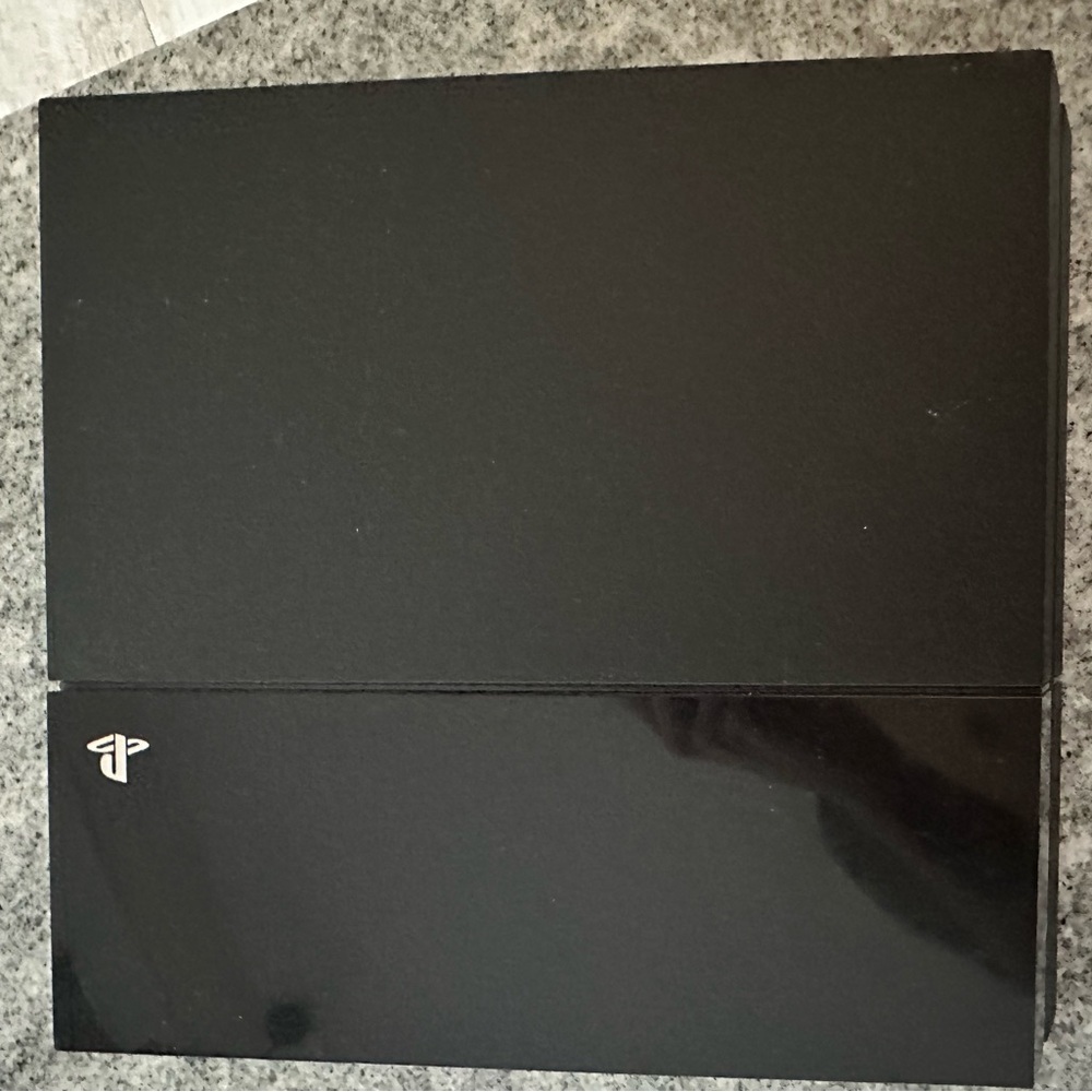 Ps4 with all the cords and a charger, free games and 1 blue controller